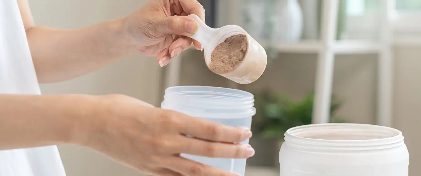 woman making a drink with protein powder