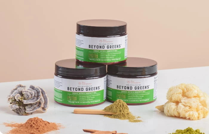 Live Conscious Beyond Greens jars next to various mushrooms and powders