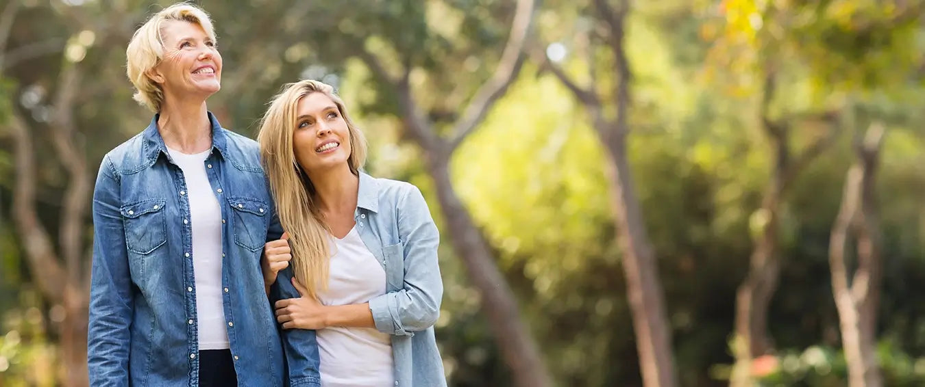 mother and daughter walking in the park