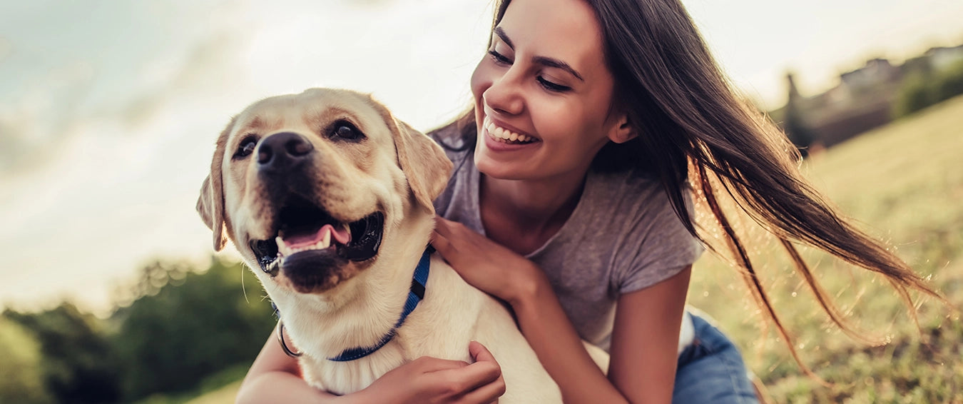 woman hugging her dog