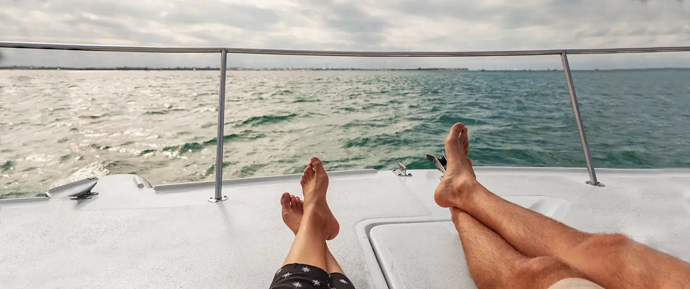 couple relaxing on their boat at the end of the summer