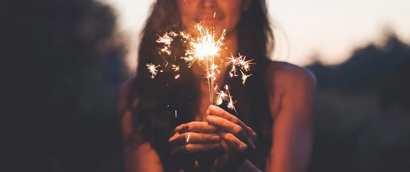 woman celebrating with sparklers