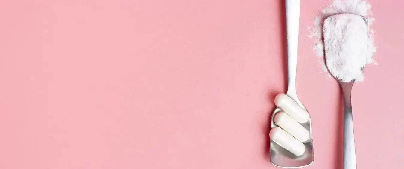 collagen capsules and collagen powder in silver spoons