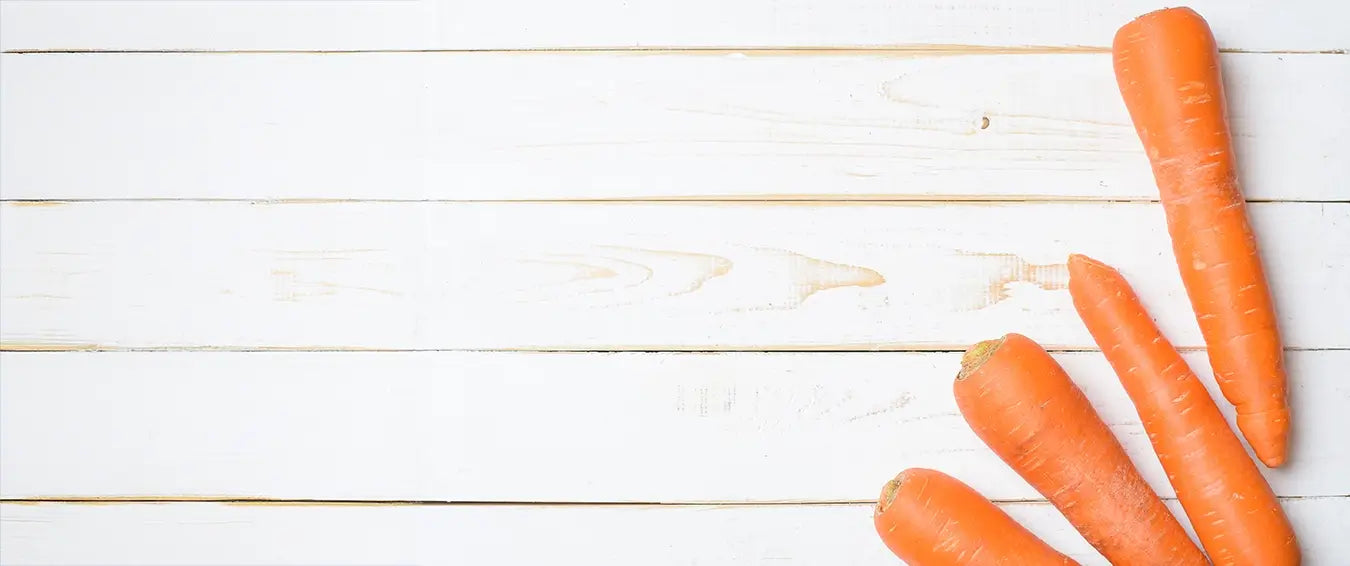 carrots on white wood