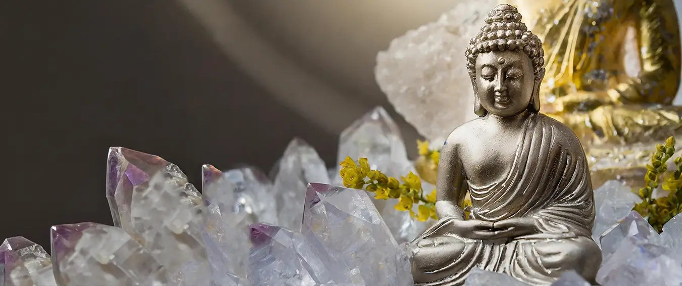 buddha statuette between crystals