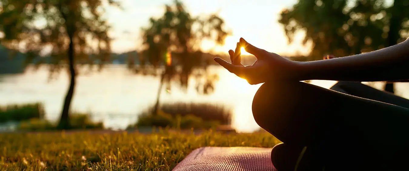 close up of the hand of a meditating woman