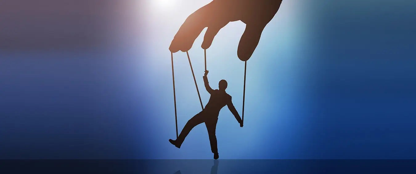 a visual depiction of an individual being manipulated through marionette ropes by a giant hand