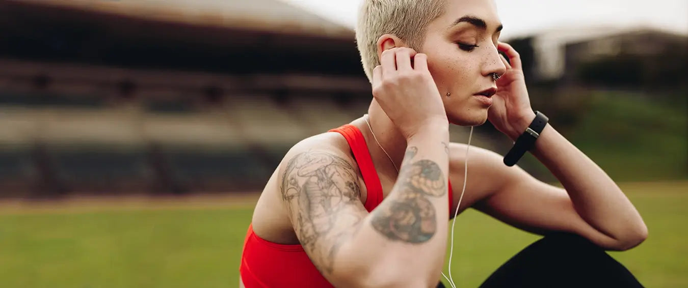 woman listening to music during her workout