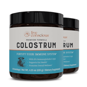 Live Conscious Colostrum powder supplement jar with black lid, featuring blue label highlighting immune system support