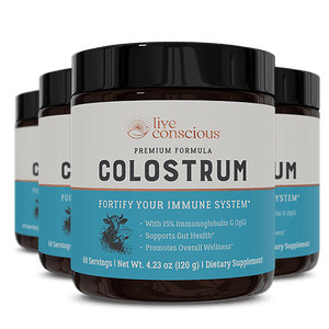 Live Conscious Colostrum supplement bottles with black caps and blue labels showing immune support benefits