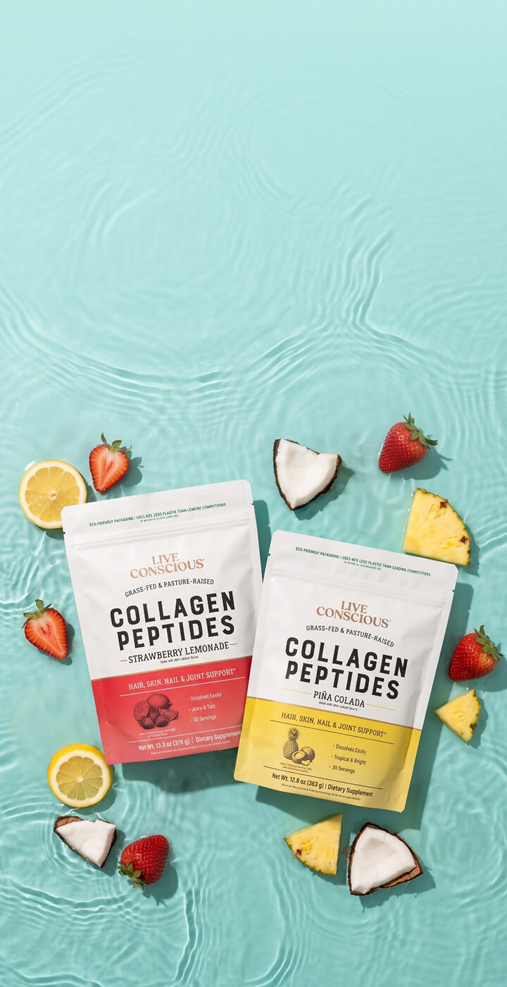 Two stand-up pouches of collagen peptides from Live Conscious are arranged on a turquoise water-textured background with strawberries, lemon slices, coconut pieces, and pineapple chunks around them. The left pouch is strawberry lemonade flavor with a red label, and the right pouch is coconut milk flavor with a yellow label.