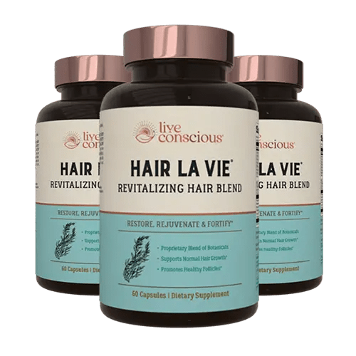 Hair La Vie Revitalizing Hair Blend supplement bottles with rose gold caps displayed in a group of three