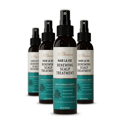 Hair La Vie Renewing Scalp Treatment spray bottles with teal and cream labels arranged in a group display