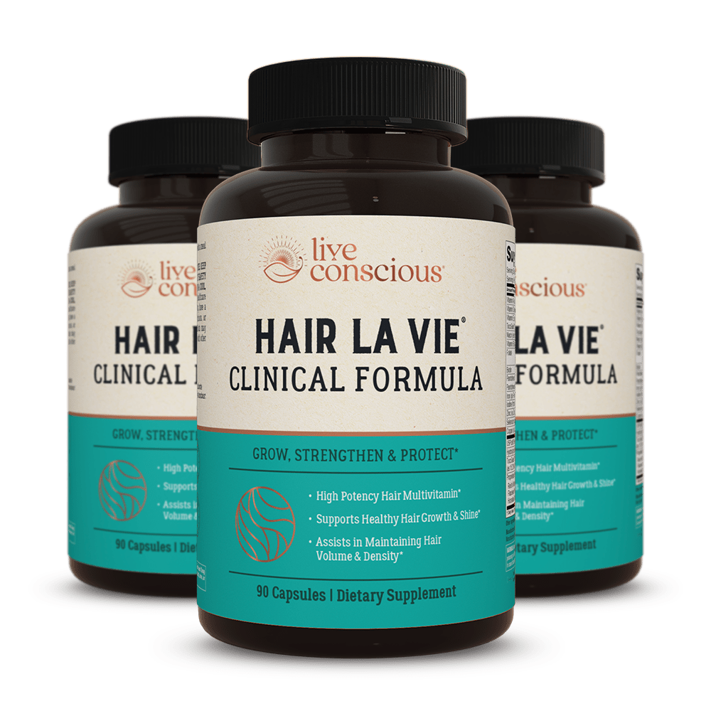 Hair La Vie Clinical Formula dietary supplement capsules by Live Conscious, 90 capsules per bottle, shown as three dark