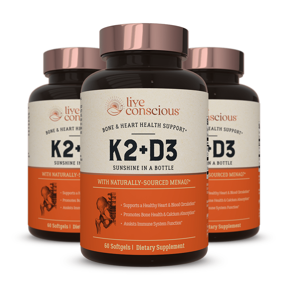 Live Conscious K2+D3 supplement bottles with rose gold caps, 60 softgels, bone and heart health support formula