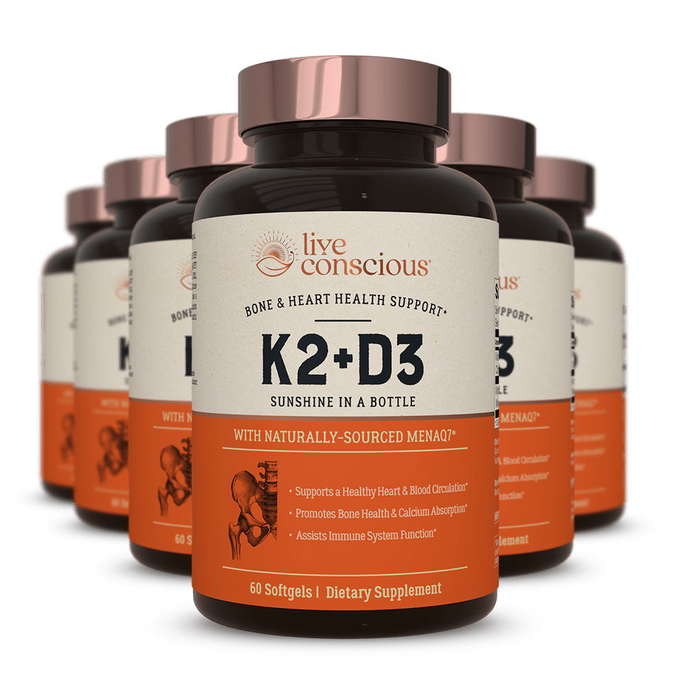 Live Conscious K2+D3 bone and heart health support supplement bottles with copper caps and orange labels, 60 softgels
